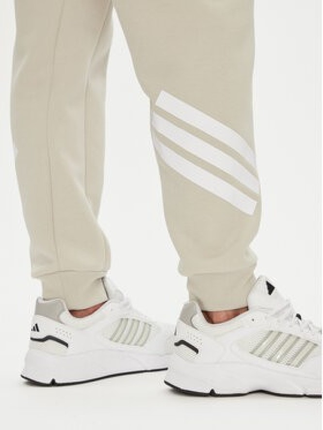adidas Spodnie dresowe Future Icons 3-Stripes JW7092 Beżowy Regular Fit