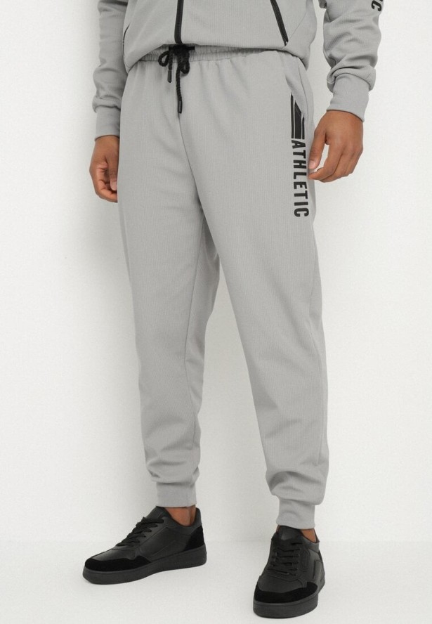 Szare Spodnie Dresowe Typu Jogger z Kieszeniami Zdobione Nadrukami Mepessa