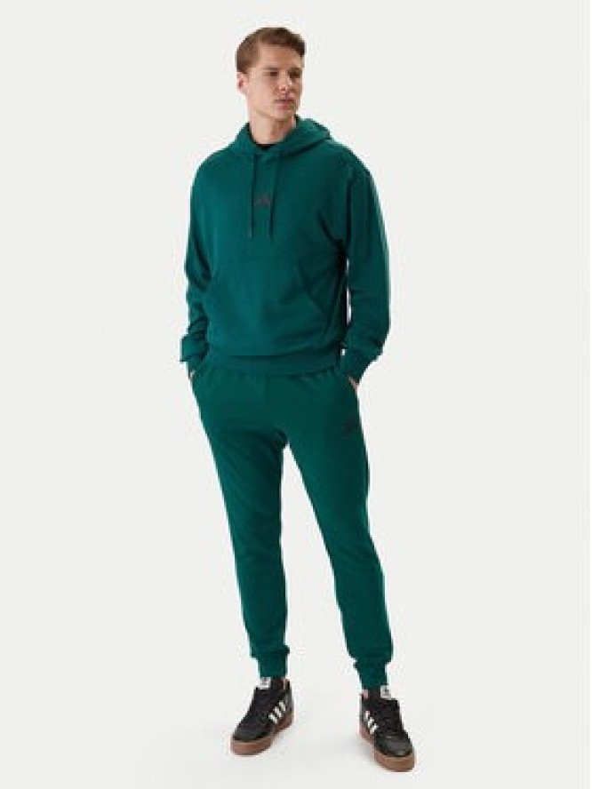 adidas Spodnie dresowe Essentials Feel Cozy JE3858 Zielony Regular Fit