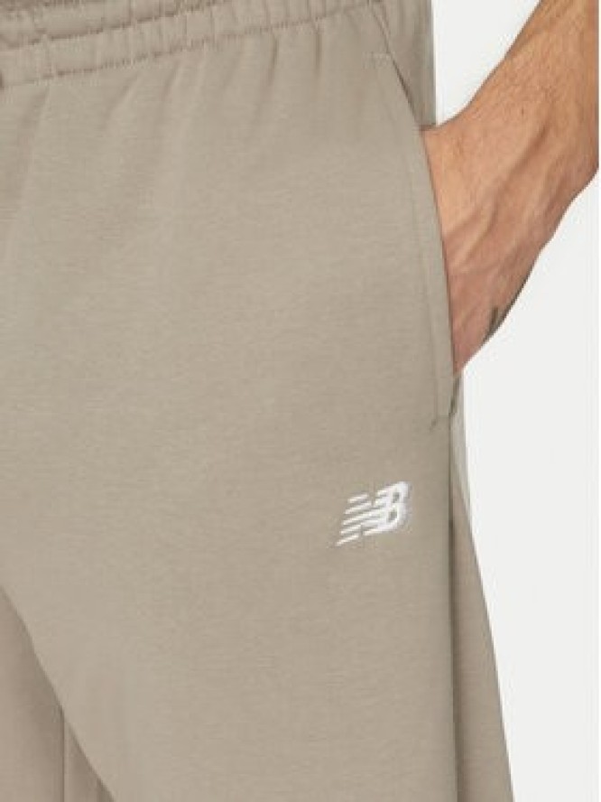 New Balance Spodnie dresowe Essentials MP41519 Beżowy Relaxed Fit