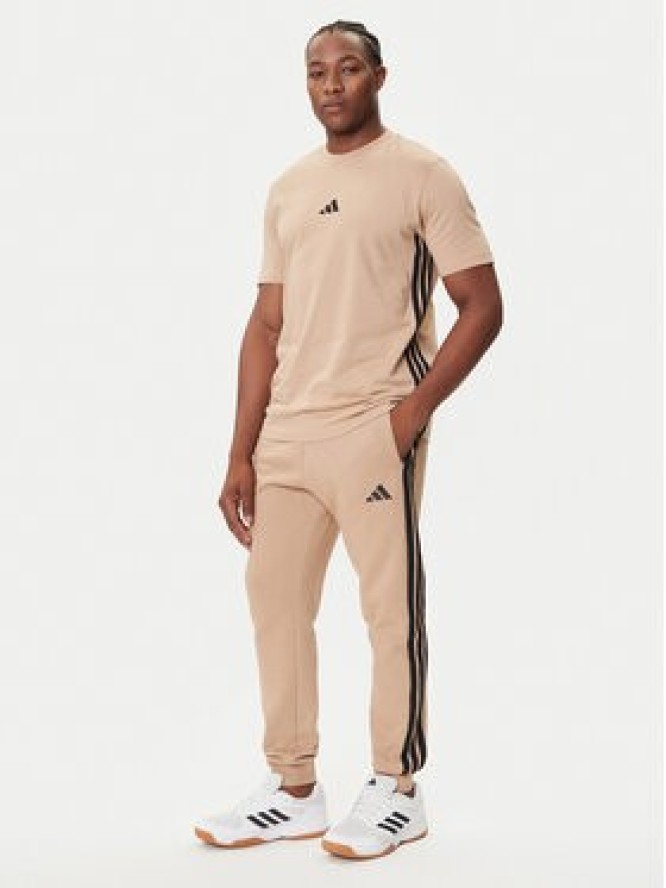 adidas Spodnie dresowe Essentials 3-Stripes JX0712 Beżowy Regular Fit