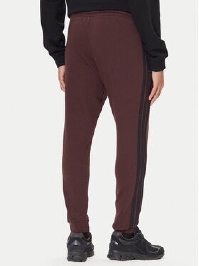 adidas Spodnie dresowe Essentials 3-Stripes JX0749 Brązowy Regular Fit