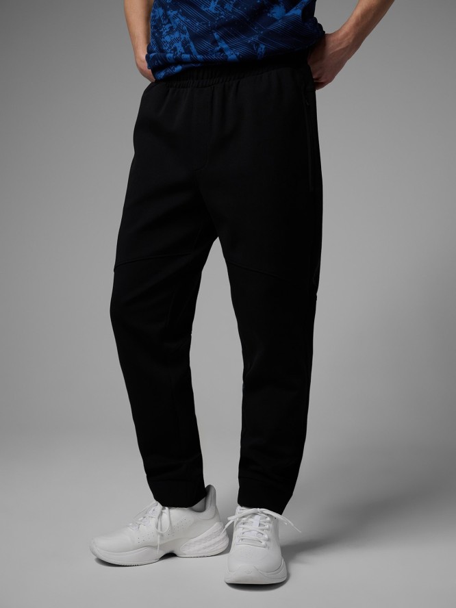 4F Spodnie dresowe joggery męskie 4F x Robert Lewandowski - czarne L