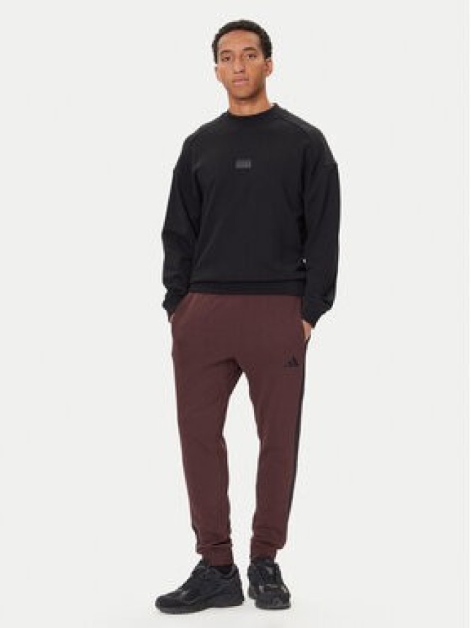 adidas Spodnie dresowe Essentials 3-Stripes JX0749 Brązowy Regular Fit