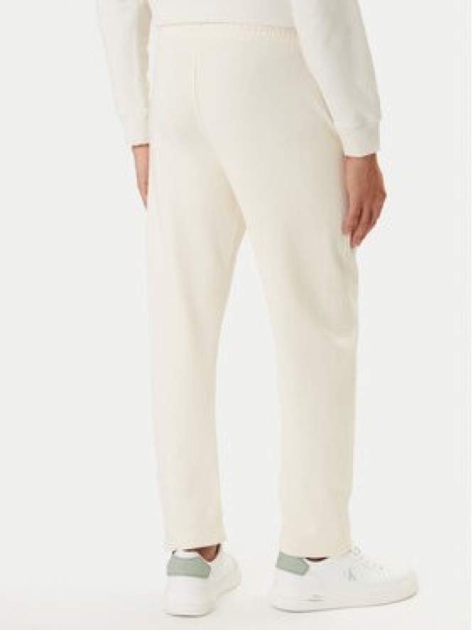 Calvin Klein Jeans Spodnie dresowe Monogram LV047F210G Beżowy Regular Fit