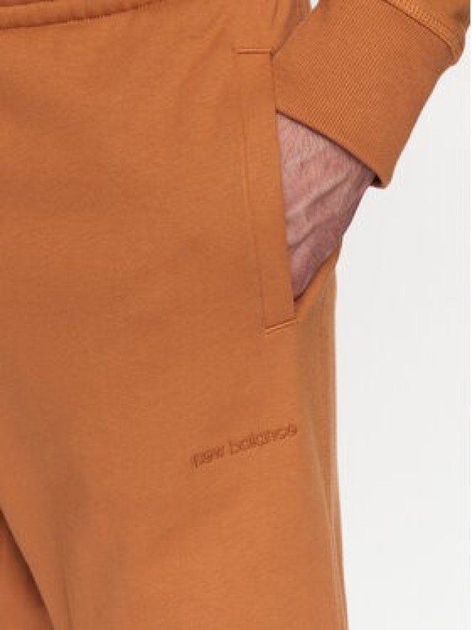 New Balance Spodnie dresowe MP23551 Pomarańczowy Relaxed Fit