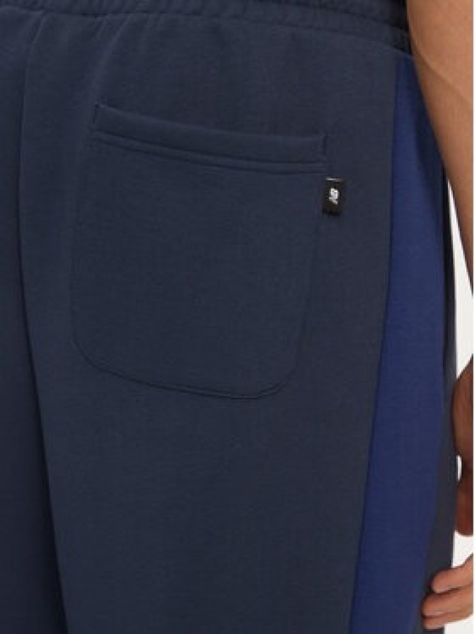 New Balance Spodnie dresowe MP43522NNY Niebieski Relaxed Fit