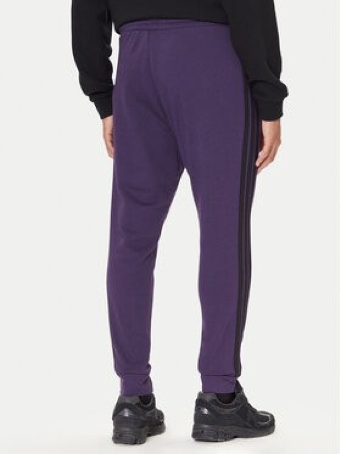 adidas Spodnie dresowe Essentials 3-Stripes JX0750 Fioletowy Regular Fit