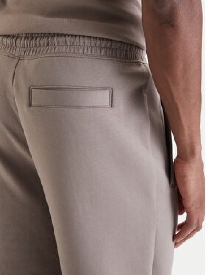 HUGO Spodnie dresowe Dimacs 50533695 Beżowy Relaxed Fit