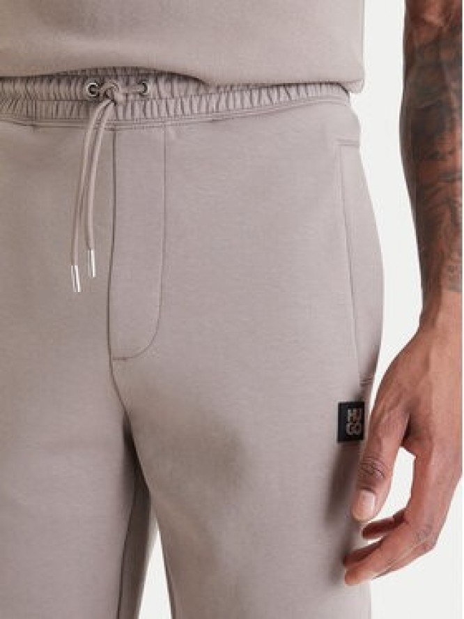 HUGO Spodnie dresowe Dimacs 50533695 Beżowy Relaxed Fit