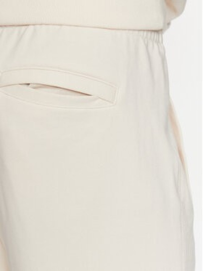 New Balance Spodnie dresowe MP23551 Écru Relaxed Fit