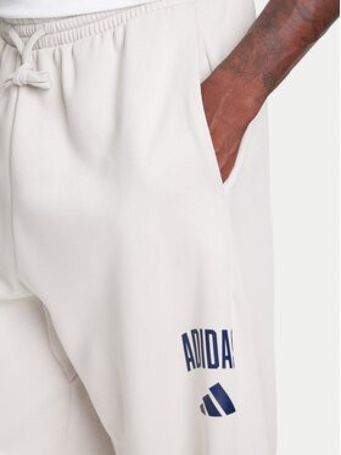 adidas Spodnie dresowe Collegiate JM9177 Beżowy Regular Fit