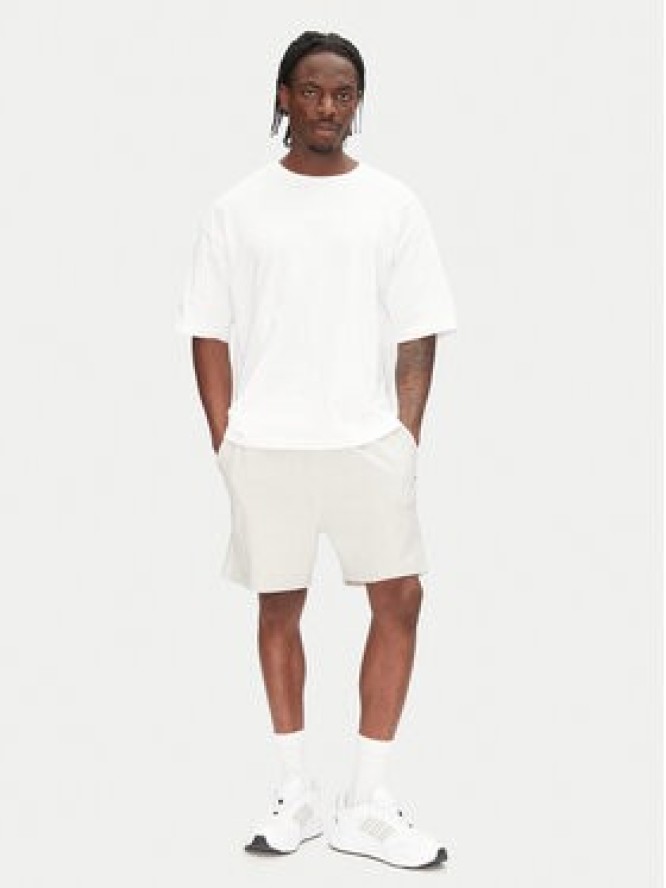 Tommy Jeans Szorty sportowe Entry Graphic DM0DM21369 Beżowy Regular Fit