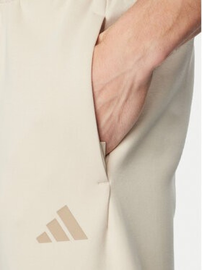 adidas Spodnie dresowe Future Icons 3-Stripes KD5206 Beżowy Regular Fit
