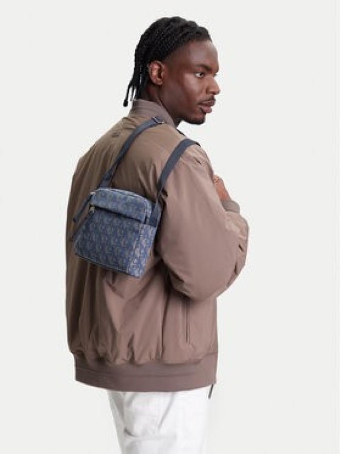 Calvin Klein Saszetka Slouched Monogram Mini Zip Fligh LV04G3175G Błękitny