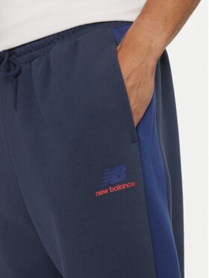 New Balance Spodnie dresowe MP43522NNY Niebieski Relaxed Fit