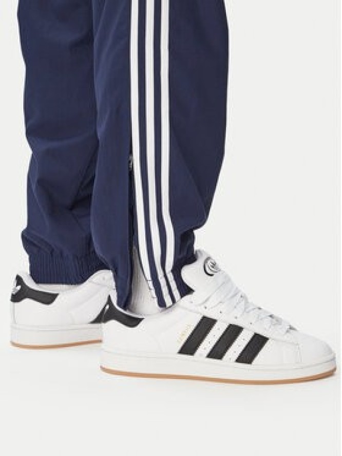 adidas Spodnie dresowe Firebird Woven KE1370 Granatowy Regular Fit