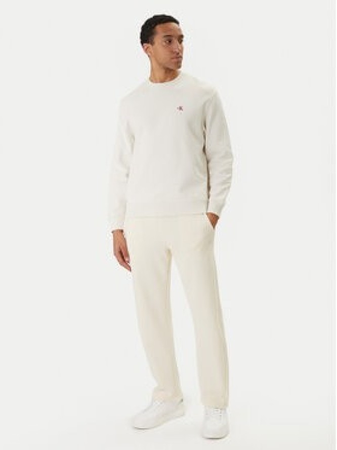 Calvin Klein Jeans Spodnie dresowe Monogram LV047F210G Beżowy Regular Fit