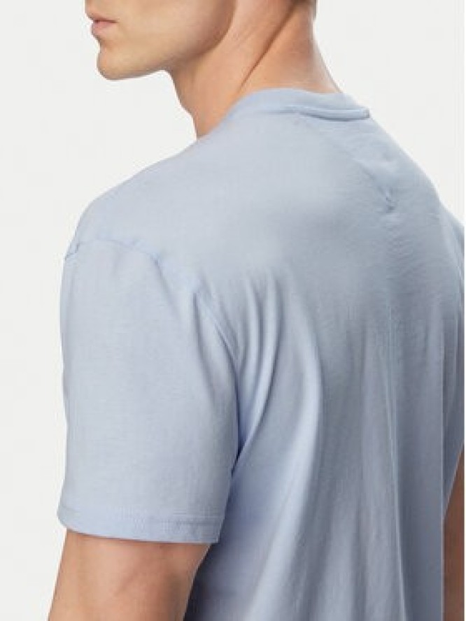 Tommy Jeans T-Shirt DM0DM20744 Niebieski jasny Regular Fit