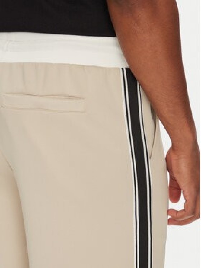 Guess Spodnie dresowe Z5YB14 KCRU2 Beżowy Regular Fit