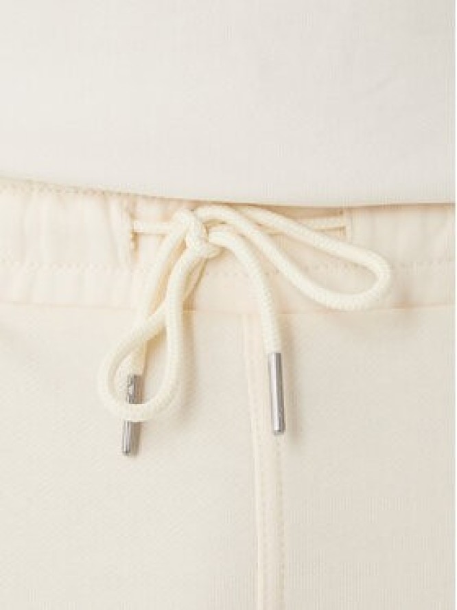 Calvin Klein Jeans Spodnie dresowe Monogram LV047F210G Beżowy Regular Fit