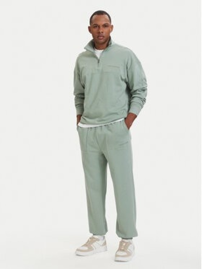Tommy Hilfiger Spodnie dresowe Essential UM0UM03911 Zielony jasny Relaxed Fit