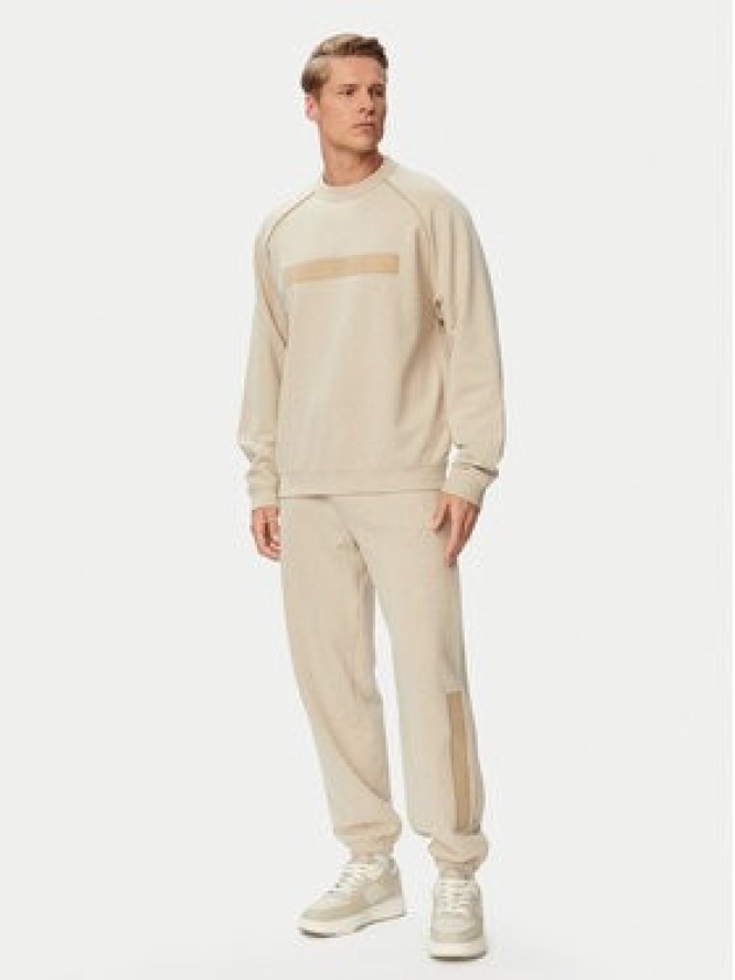 HUGO Spodnie dresowe Dalipant 50563100 Beżowy Relaxed Fit