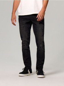 Jeansy slim fit z przetarciami i efektem sprania - czarny