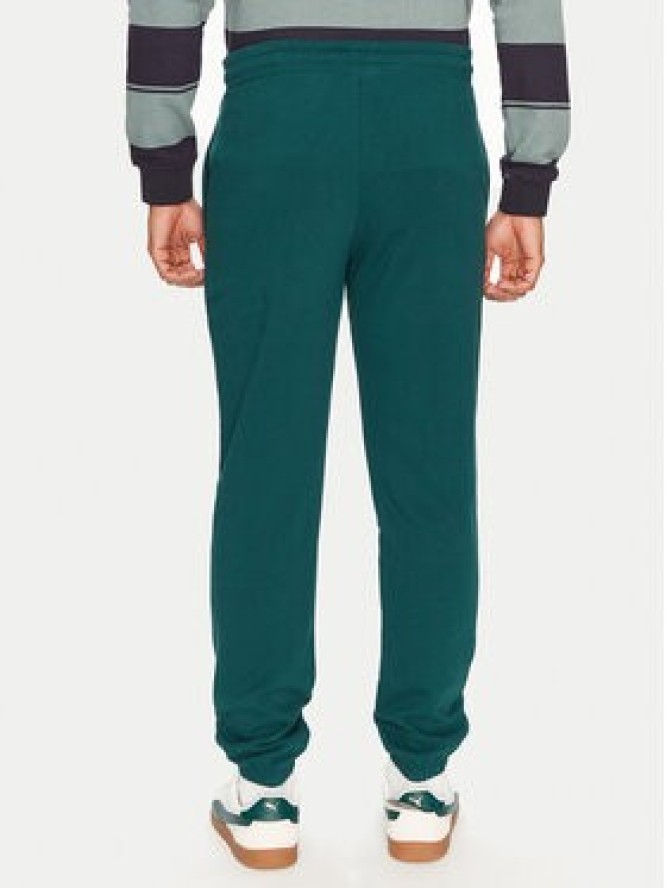 Puma Spodnie dresowe Sports Legacy Graphic 629631 Zielony Regular Fit