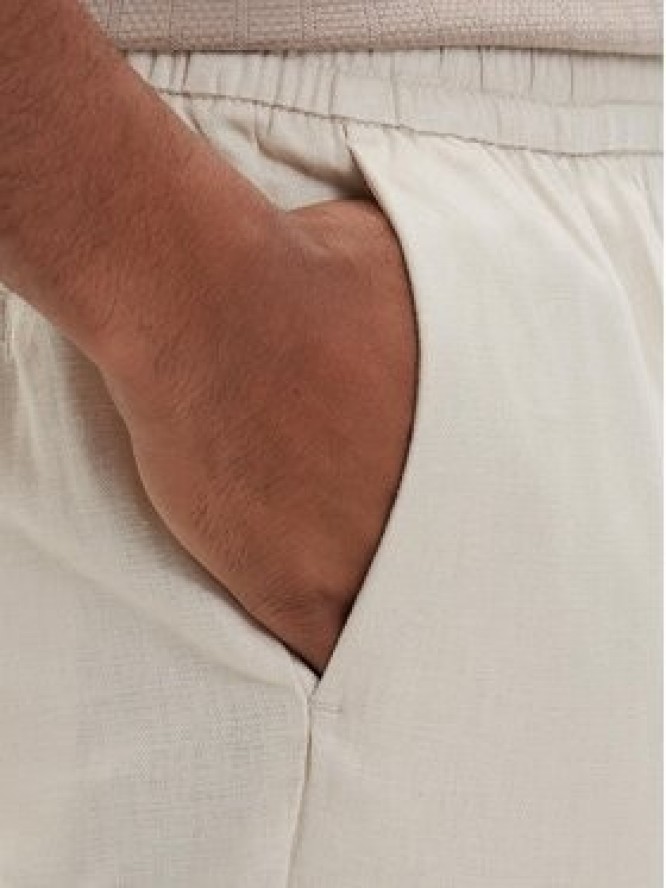 Calvin Klein Spodnie materiałowe LV04LF619G Beżowy jasny Straight Fit