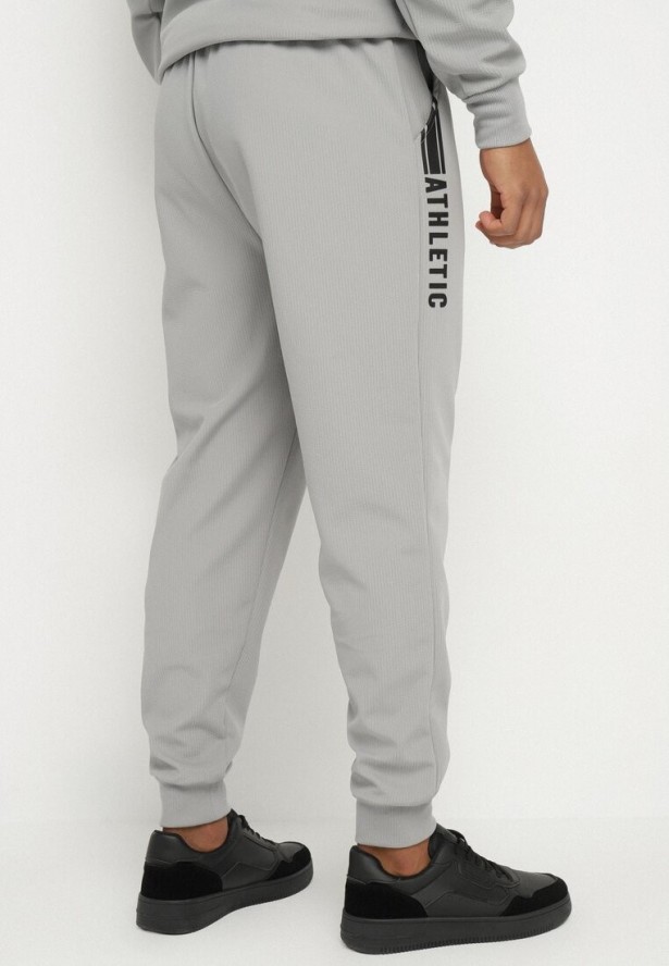 Szare Spodnie Dresowe Typu Jogger z Kieszeniami Zdobione Nadrukami Mepessa