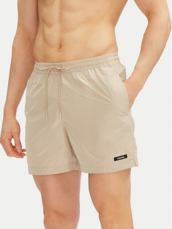 Calvin Klein Swimwear Szorty kąpielowe KM0KM01111 Beżowy Regular Fit