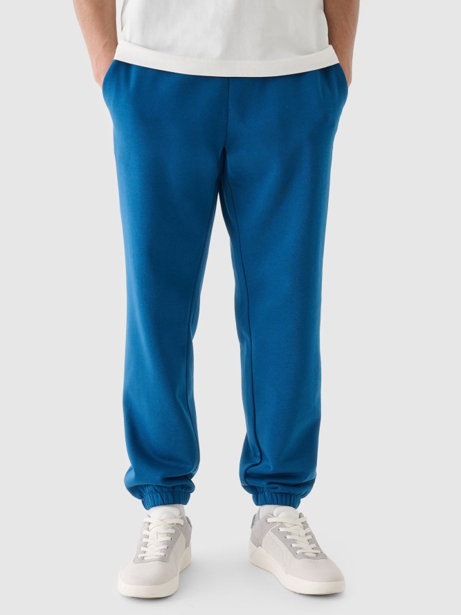 4F Spodnie dresowe joggery męskie - turkusowe L