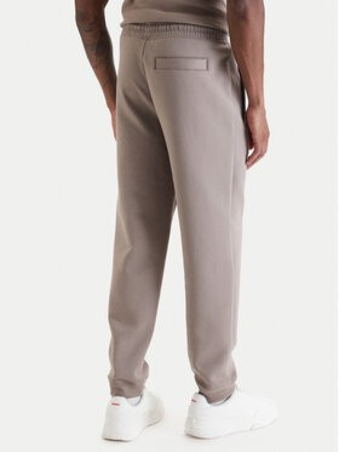 HUGO Spodnie dresowe Dimacs 50533695 Beżowy Relaxed Fit