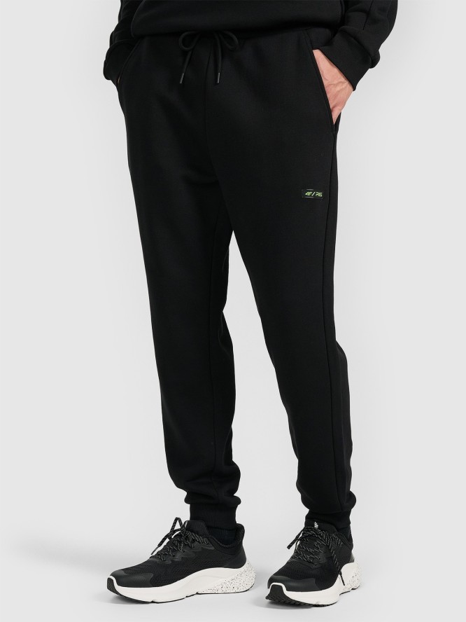 4F Spodnie dresowe joggery męskie 4F x Robert Lewandowski - czarne S
