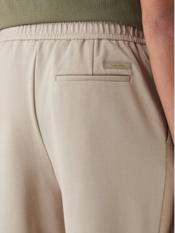 Calvin Klein Spodnie materiałowe LV04LF607G Beżowy Tapered Fit