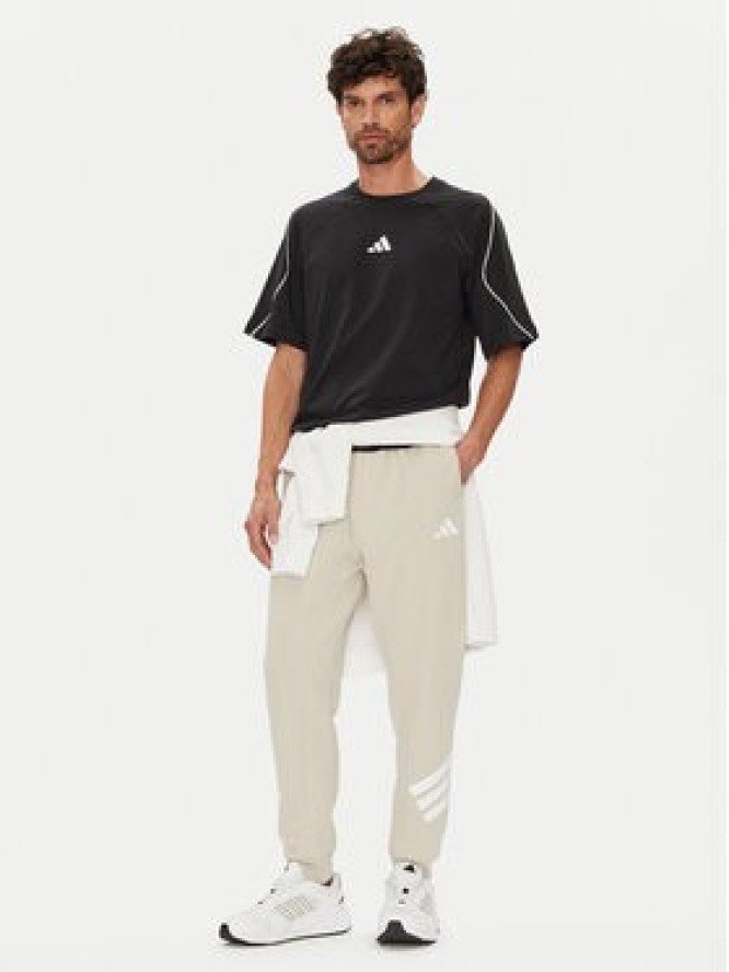 adidas Spodnie dresowe Future Icons 3-Stripes JW7092 Beżowy Regular Fit