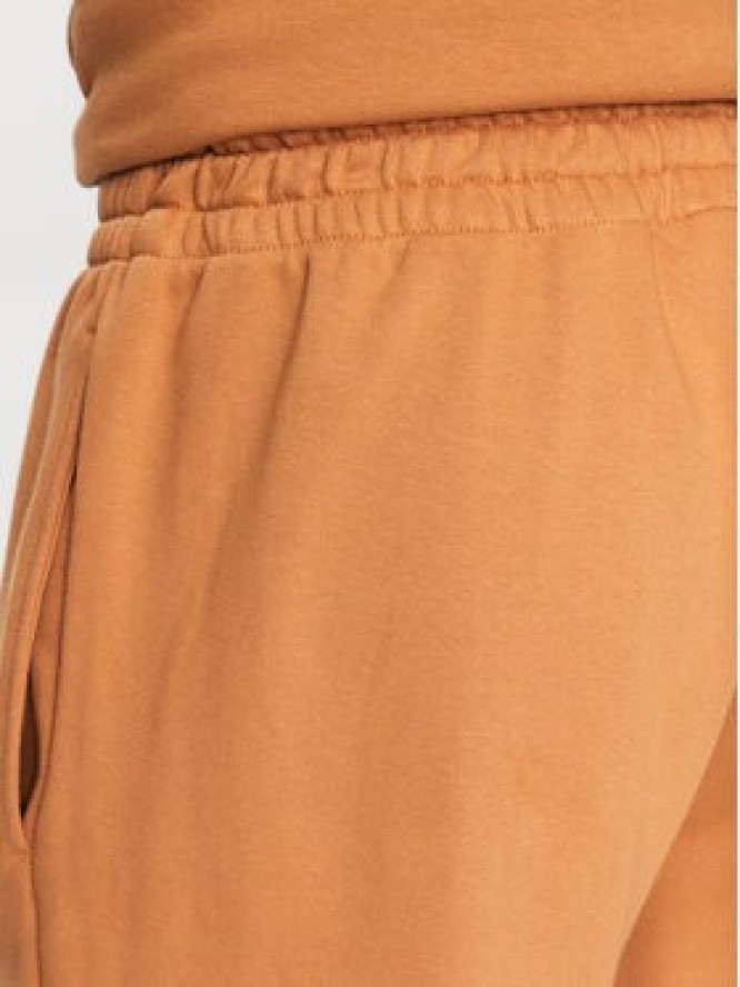 New Balance Spodnie dresowe MP31539 Żółty Regular Fit