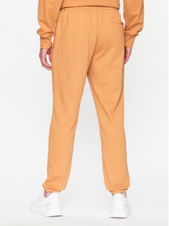 New Balance Spodnie dresowe MP31539 Żółty Regular Fit