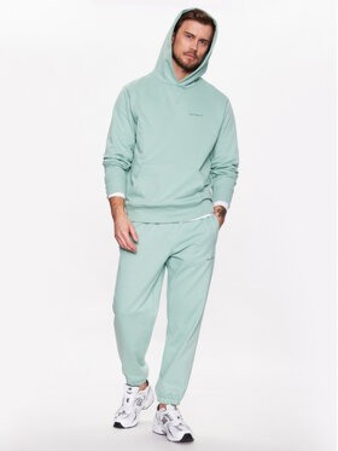 New Balance Spodnie dresowe MP23551 Zielony Relaxed Fit