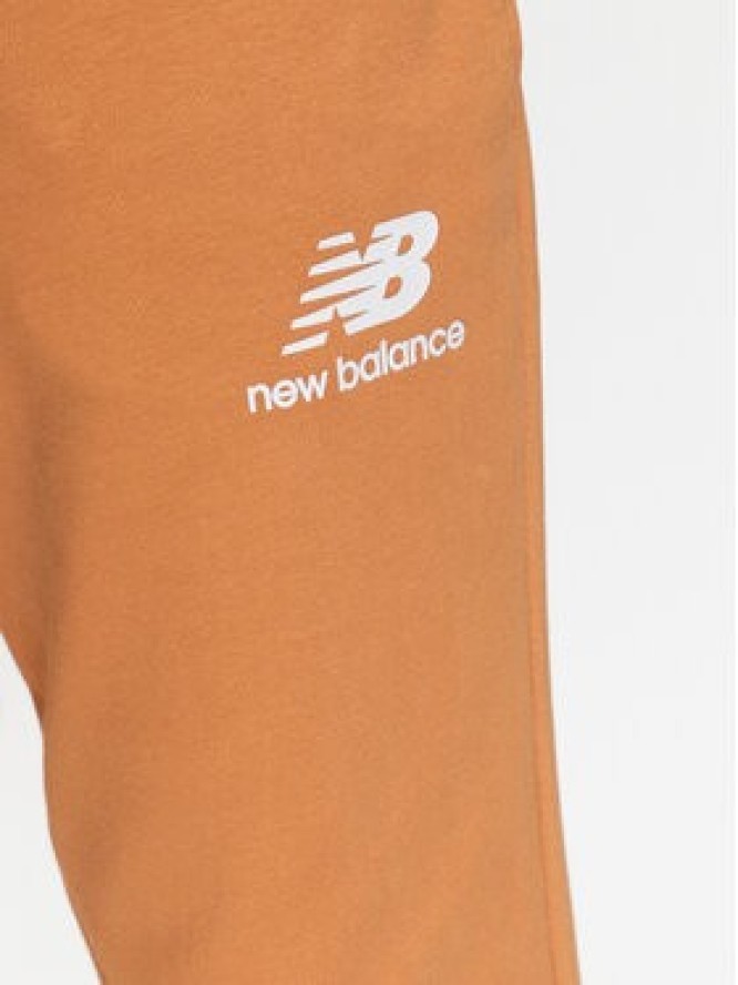 New Balance Spodnie dresowe MP31539 Żółty Regular Fit