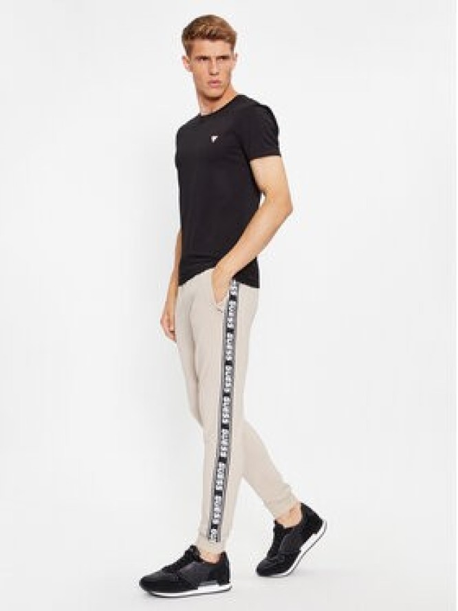Guess Spodnie dresowe Z2YB19 K6ZS1 Beżowy Regular Fit