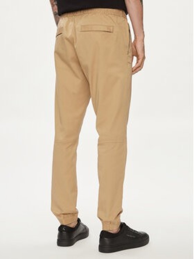 Calvin Klein Jeans Joggery Monologo Badge J30J325114 Beżowy Skinny Fit