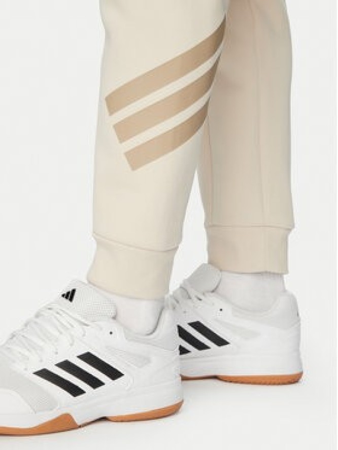adidas Spodnie dresowe Future Icons 3-Stripes KD5206 Beżowy Regular Fit